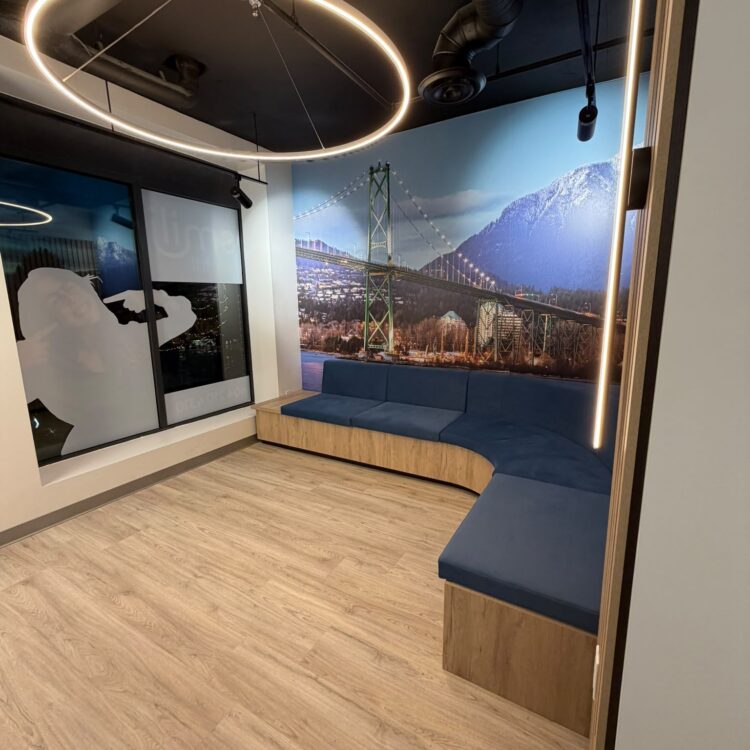 Patient waiting room with blue bench seating and a Lions Gate Bridge mural at Smili Dental North Vancouver